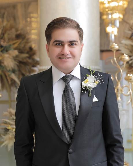 A person in a suit
AI-generated content may be incorrect.